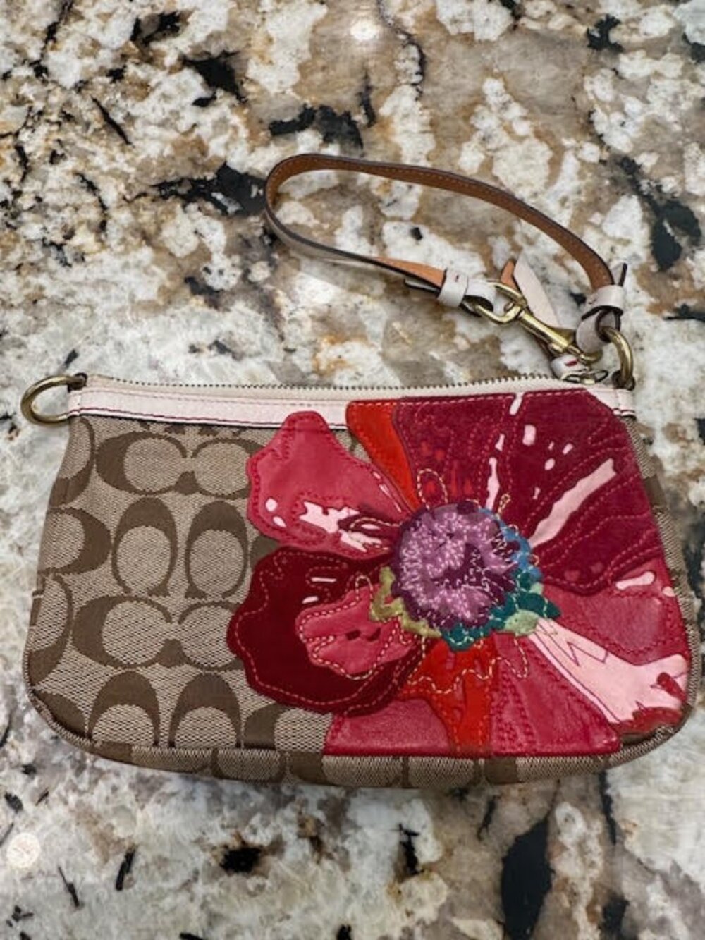 Coach wrislet with floral embroidery